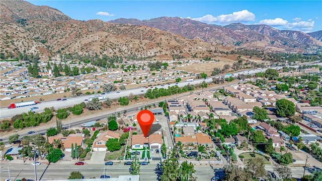 birds eye view of property featuring a mountain view