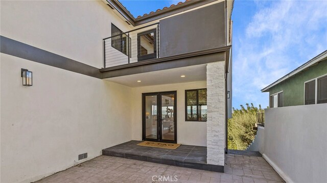 doorway to property with french doors