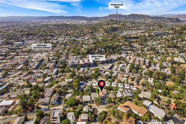 drone / aerial view featuring a mountain view