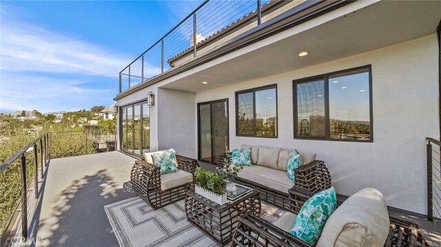 view of patio / terrace featuring outdoor lounge area and a balcony