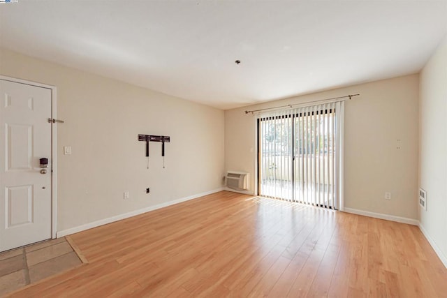 spare room with light hardwood / wood-style floors