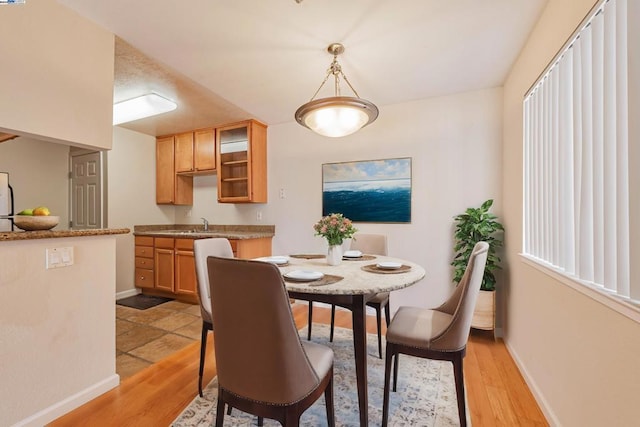 dining space featuring light hardwood / wood-style floors