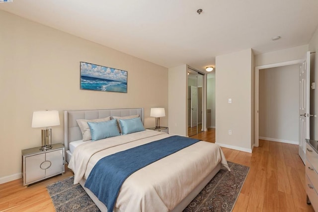 bedroom with light hardwood / wood-style floors