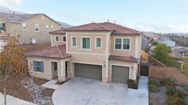 mediterranean / spanish-style home featuring a garage