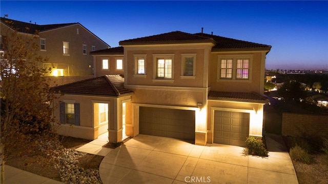 mediterranean / spanish-style home featuring a garage