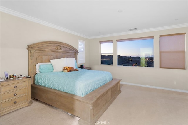 bedroom featuring crown molding and light carpet