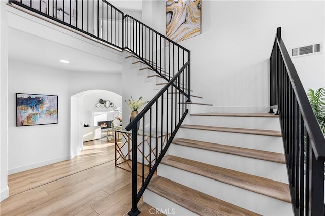 stairway featuring wood-type flooring