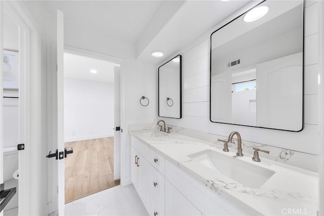 bathroom featuring hardwood / wood-style flooring and vanity