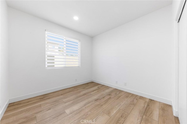 unfurnished room featuring light hardwood / wood-style flooring