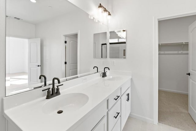 bathroom with vanity and tile patterned floors