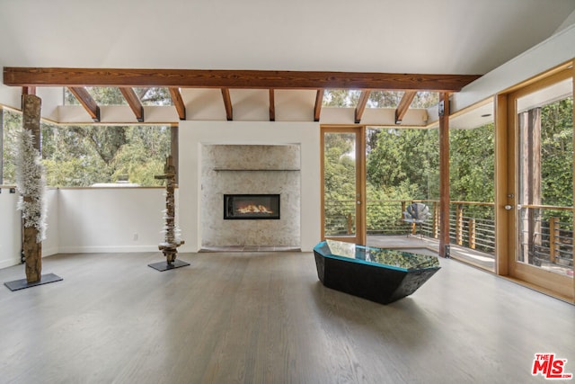 interior space featuring vaulted ceiling with beams and plenty of natural light