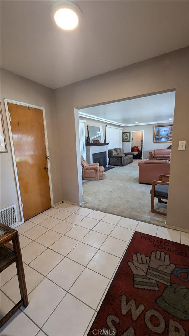 hallway featuring light colored carpet