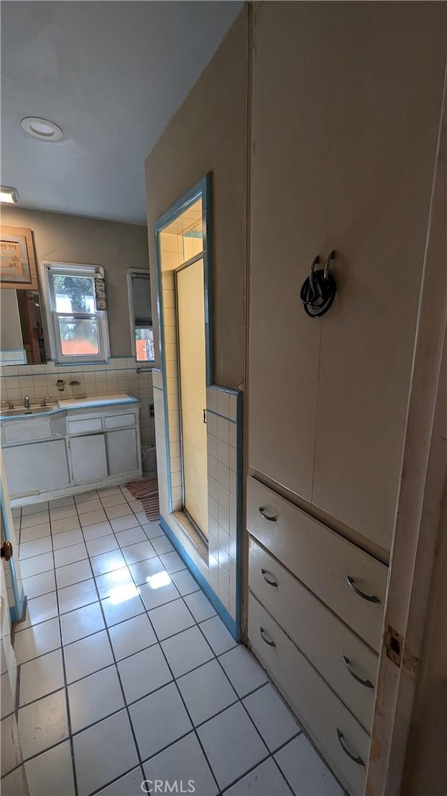 bathroom featuring tile patterned flooring and vanity