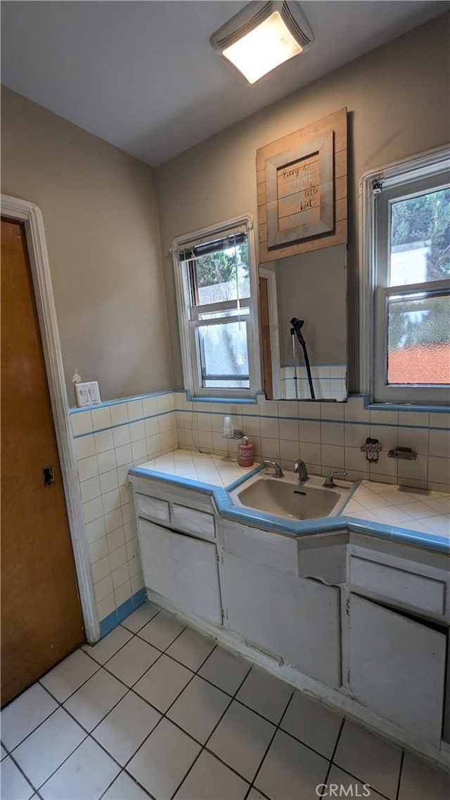 bathroom with vanity, tile patterned floors, and plenty of natural light