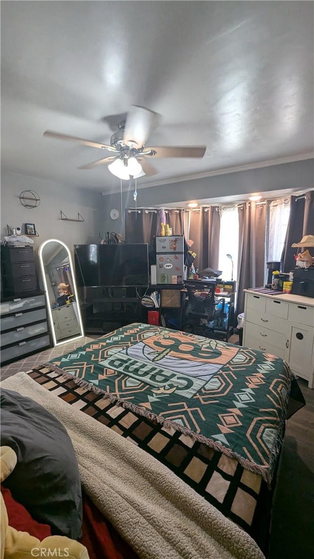 bedroom with ceiling fan and ornamental molding