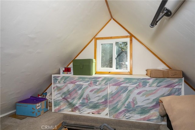 bedroom featuring carpet flooring and lofted ceiling