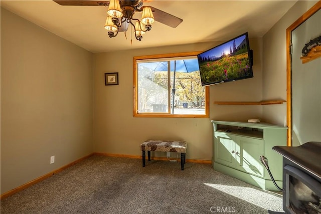 sitting room with carpet flooring and ceiling fan