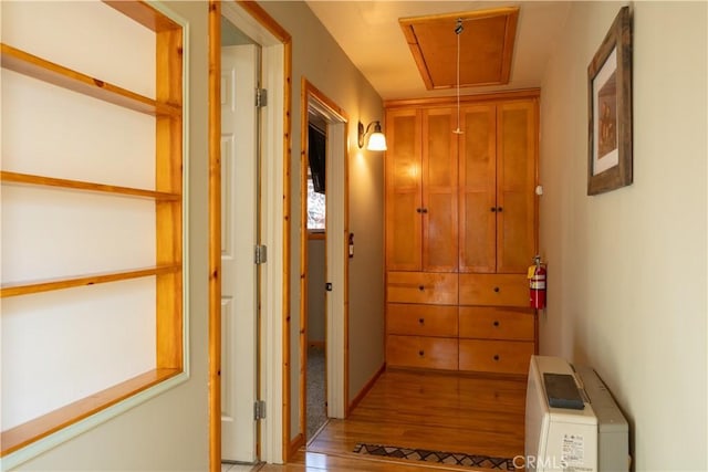 hall with light hardwood / wood-style floors