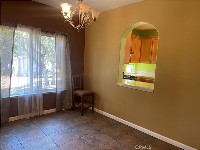 empty room with a notable chandelier