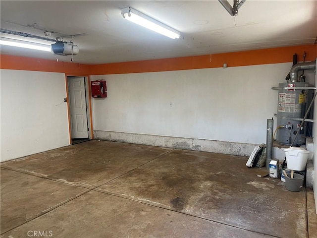 garage with a garage door opener and water heater