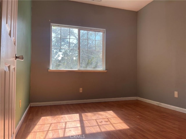 spare room with light hardwood / wood-style floors