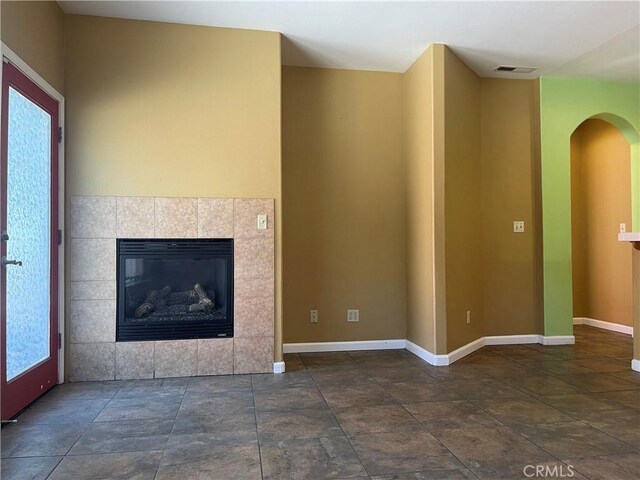 unfurnished living room with a fireplace