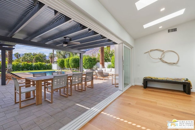 view of patio with a pool, an outdoor living space, and a pergola