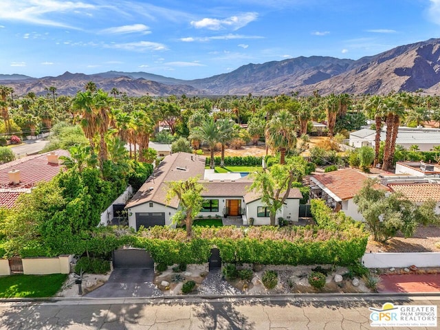 birds eye view of property featuring a mountain view