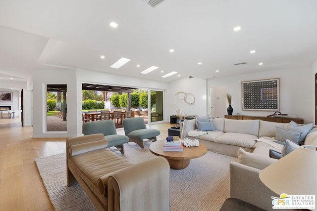 living room with light hardwood / wood-style flooring