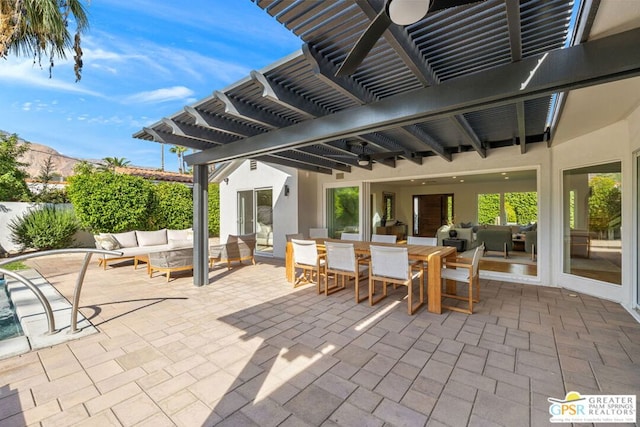 view of patio / terrace featuring a mountain view, an outdoor hangout area, and a pergola