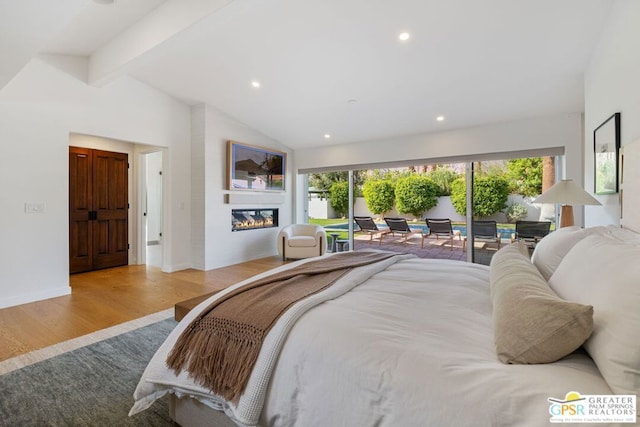 bedroom with multiple windows, access to exterior, light hardwood / wood-style flooring, and vaulted ceiling with beams