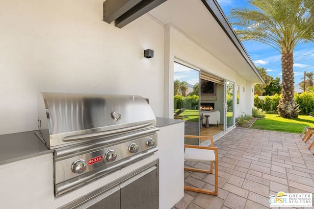 view of patio / terrace featuring area for grilling and a grill