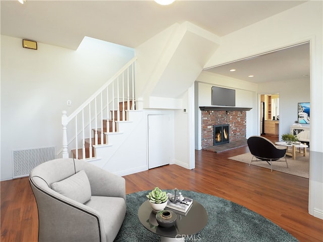 living room featuring hardwood / wood-style floors and a fireplace