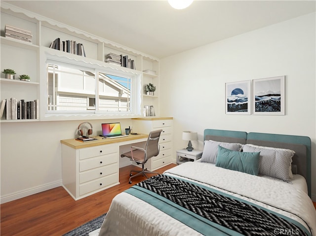 bedroom with hardwood / wood-style flooring