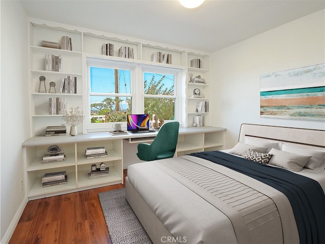 bedroom featuring dark hardwood / wood-style floors