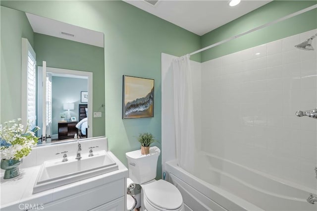 full bathroom featuring vanity, toilet, and shower / tub combo