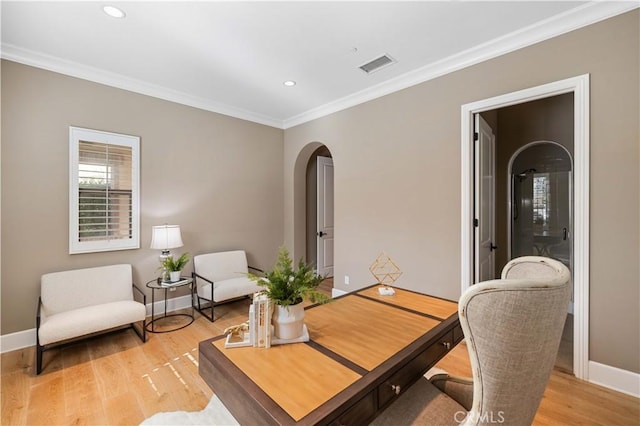 office area featuring light hardwood / wood-style flooring and ornamental molding