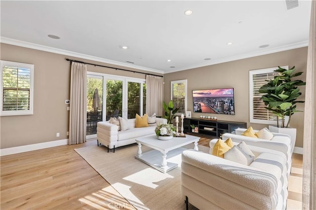 living room with light wood-type flooring and crown molding