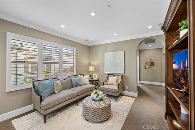 carpeted living room with crown molding