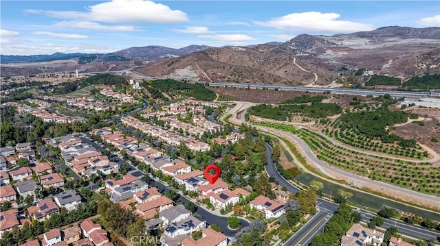 drone / aerial view featuring a mountain view