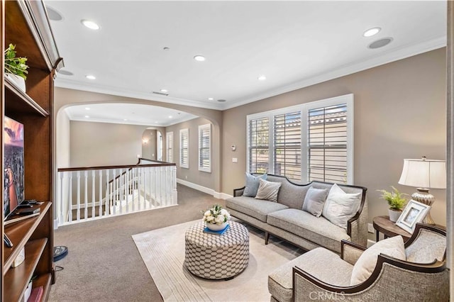 living room with carpet floors and crown molding