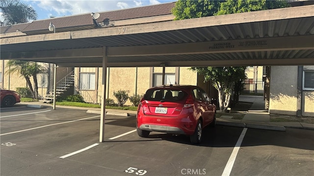 view of parking / parking lot with a carport