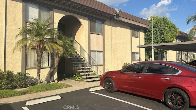 exterior space with a carport