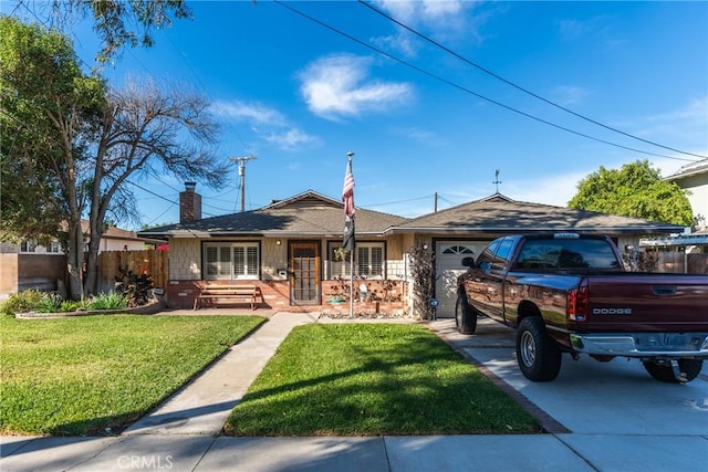 ranch-style home featuring a front lawn and a garage