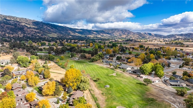 birds eye view of property featuring a mountain view