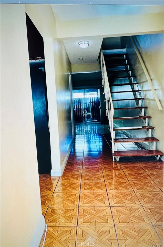 hallway featuring tile patterned flooring