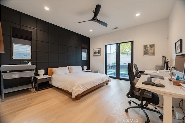 bedroom with light hardwood / wood-style flooring, access to outside, and ceiling fan