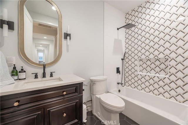 full bathroom featuring vanity, tile patterned floors, shower / washtub combination, and toilet