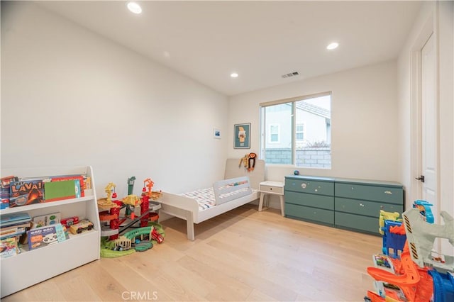 bedroom with light wood-type flooring