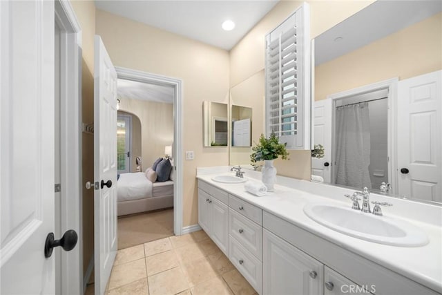 bathroom featuring tile patterned flooring, a shower with curtain, and vanity